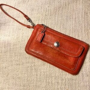 COACH Hamilton Pebble Leather Flap Wristlet in Geranium Coral Orange